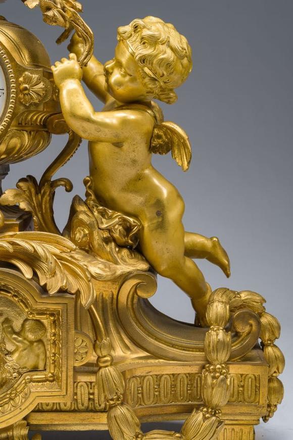 Coronari Auctions BVA fine and exceptional French Napoleon III gilt bronze three-piece clock garniture with putti and floral design, 19th C.