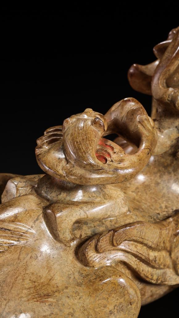 JUBAO HALL AUCTION HOUSE INCPre-Ming Dynasty Feathered Man Taming a Beast