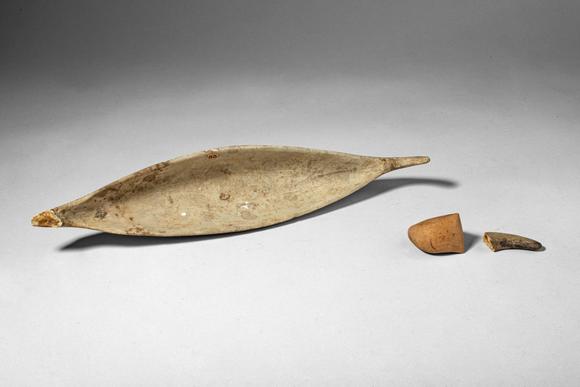 Apollo Art AuctionsCa. 20th century AD. >
A collection comprising a finely shaped canoe model from the Trobriand Isl