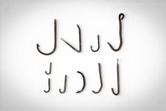 Apollo Art AuctionsCa. 1st - 4th century AD. >
A group comprising ten bronze fish hooks of varying size and form, in