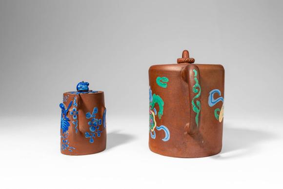 Apollo Art AuctionsQing Dynasty, Ca. AD 1644 - 1912. >A charming pair of Yixing stoneware teapots, each decorated wi