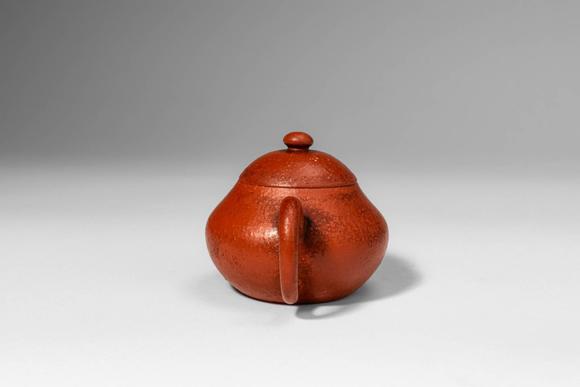 Apollo Art AuctionsQing Dynasty, Ca. AD 1644 - 1912. >A Yixing stoneware teapot of compact, globular form, the round