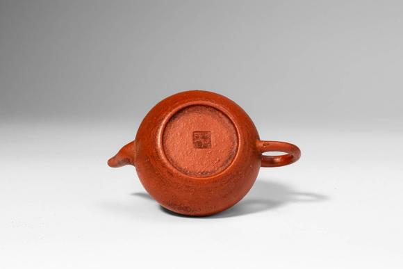 Apollo Art AuctionsQing Dynasty, Ca. AD 1644 - 1912. >A Yixing stoneware teapot of compact, globular form, the round