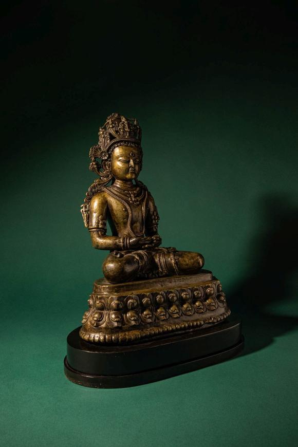 Apollo Art AuctionsCa. 14th century AD. >
A finely cast copper alloy figure depicting Kunzang Akor, seated in serene