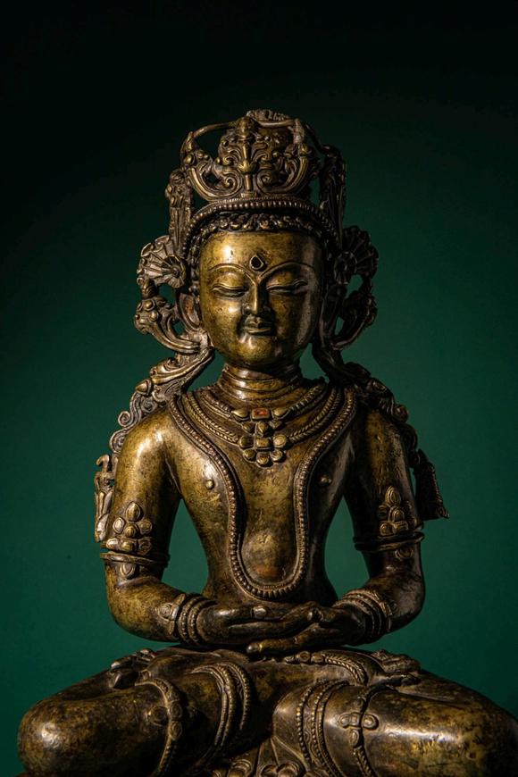 Apollo Art AuctionsCa. 14th century AD. >
A finely cast copper alloy figure depicting Kunzang Akor, seated in serene