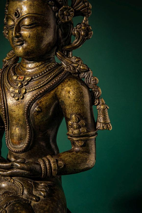 Apollo Art AuctionsCa. 14th century AD. >
A finely cast copper alloy figure depicting Kunzang Akor, seated in serene