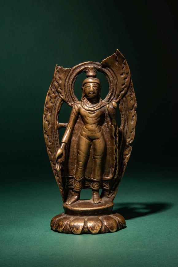 Apollo Art AuctionsCa. 10th - 11th century AD. >
A finely cast bronze figure of Buddha Shakyamuni standing in a fron