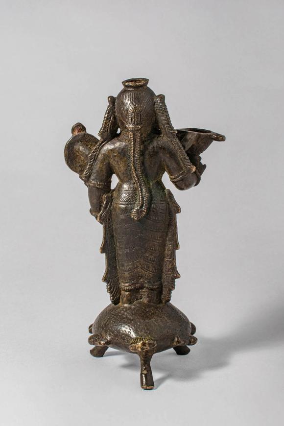 Apollo Art AuctionsCa. 14th-15th century AD. A bronze oil lamp cast in the form of Goddess Lakshmi, the consort of V