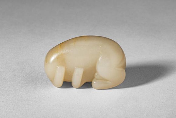 Apollo Art AuctionsMid Qing Dynasty, Ca. 18th century AD. >
A carved jade figure of a recumbent horse, depicted in a