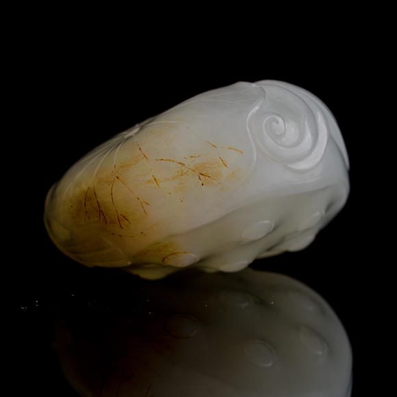 Oakridge Auction Gallery十八/十九世紀(jì) 白玉雕蓮蓬把件  A Chinese carved white jade carving of a lotus pod