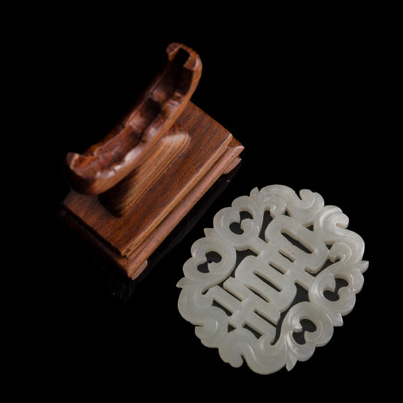 Oakridge Auction Gallery十九世紀(jì)早 白玉鏤雕喜字佩（附木座）  A Chinese reticulated white jade 'happiness' plaque