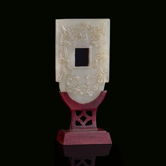 Oakridge Auction Gallery十九世紀 白玉雕螭龍紋斧形佩（附木架）  A Chinese carved white jade 'chilong' axe-form plaque