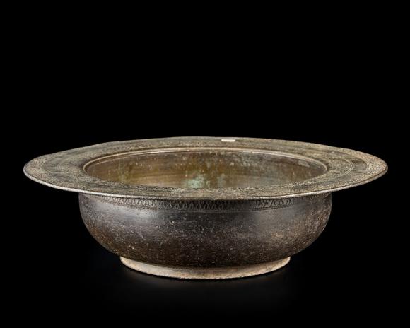 RoseberysA Mughal engraved basin,?
North India, second half 18th century or later,

Of deep form, with rounded cavetto and wide flat lip, two bands of repe
