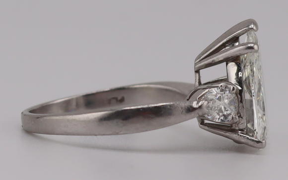 Clarke Auction GalleryJEWELRY. Platinum and 3.59ct Pear Diamond Ring.