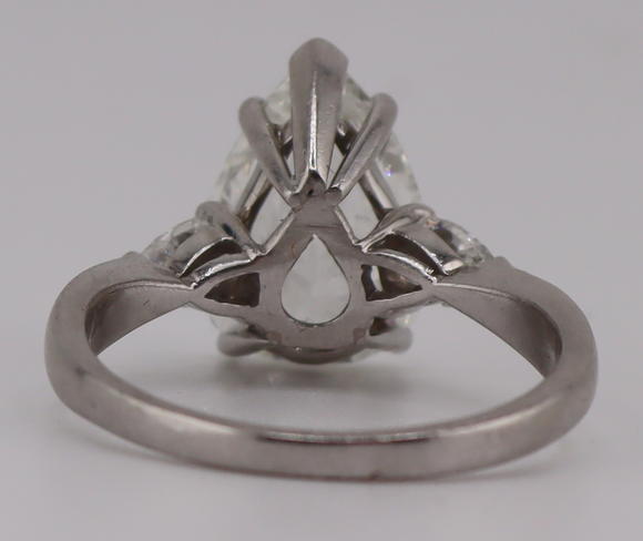 Clarke Auction GalleryJEWELRY. Platinum and 3.59ct Pear Diamond Ring.