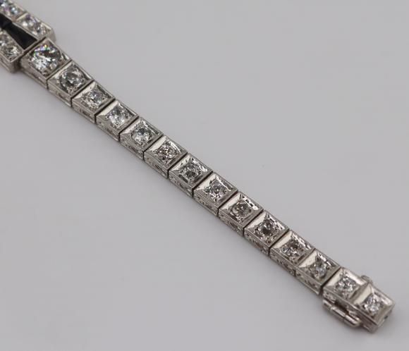 Clarke Auction GalleryJEWELRY. Art Deco Platinum, Diamond and Onyx