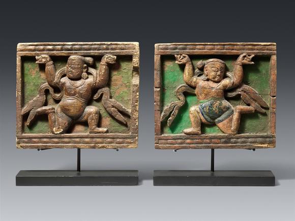 Kunsthaus Lempertz KGA rare and important pair of Tibetan gilt wooden panels with yakshas. 13/14th century