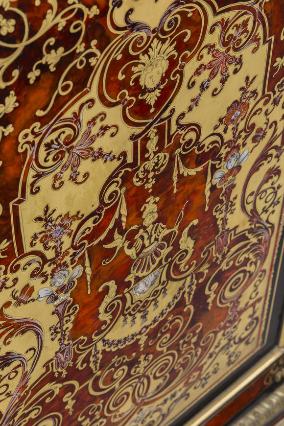 Piguet - H?tel des VentesBibliothèque d'époque Louis XIV, en marqueterie d'écaille rouge, nacre et laiton, riche ornementation de bronze doré, 233x146x52 cm