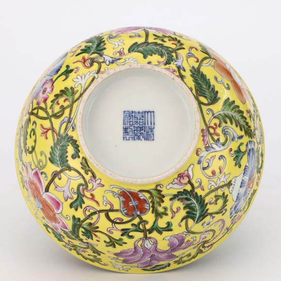 KARSON AUCTIONQing Dynasty Jiaqing period, Yellow-ground famille rose bowl with passion flower patterns