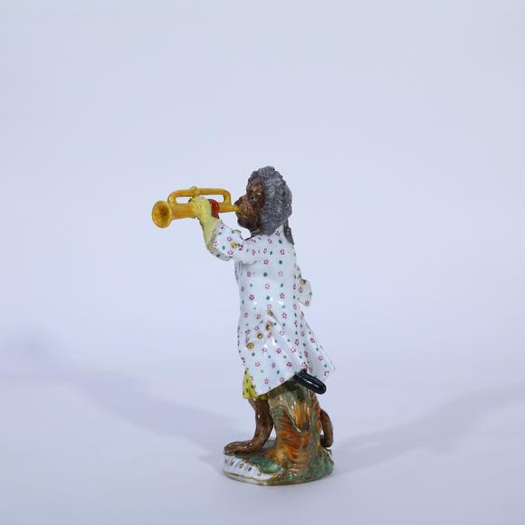KARSON AUCTION18th Century Meissen Porcelain Figurine of Trumpeting Monkey from the Monkey Band, designed by Johann Joachim K?ndler