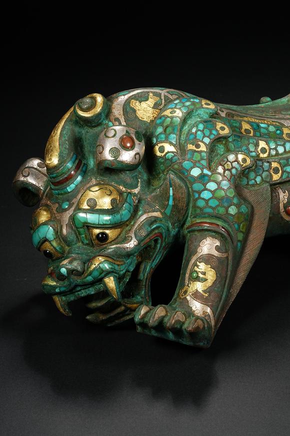 HUNG YUN ZHAI AUCTION HOUSE INCPre-Ming Dynasty Gold and Silver Inlaid Inscribed Mythical Beast