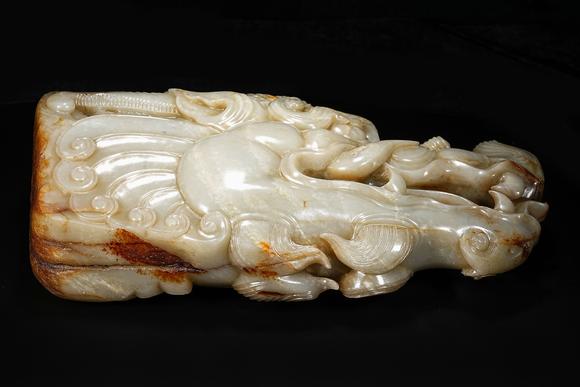 HUNG YUN ZHAI AUCTION HOUSE INCPre-Ming Dynasty or Earlier Hetian Jade Dragon-Head Ornament