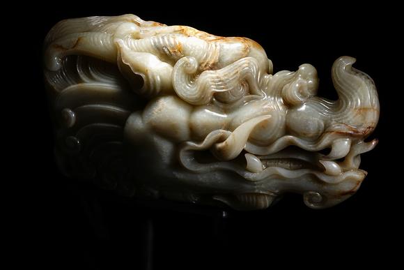 HUNG YUN ZHAI AUCTION HOUSE INCPre-Ming Dynasty or Earlier Hetian Jade Dragon-Head Ornament