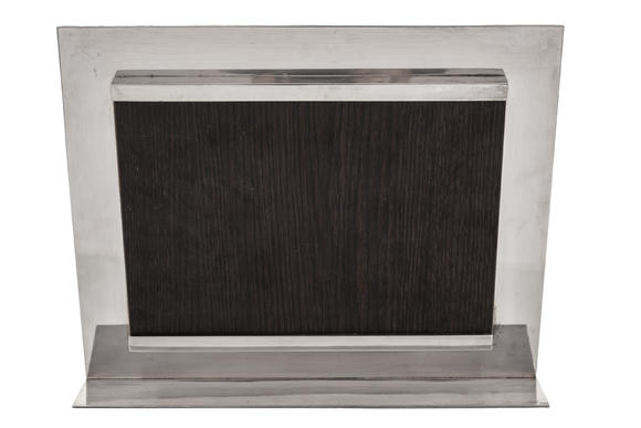 Piguet - H?tel des VentesHERMèS. Cadre à photographie en métal argenté, Paris, XXe s., revers en bois, h. 26 cm