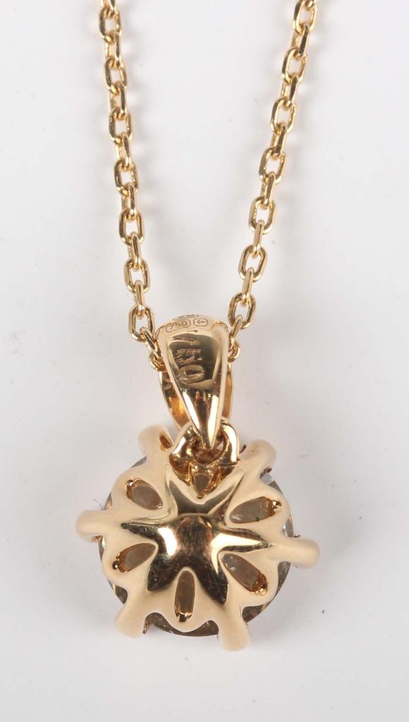 TooveysAn 18ct gold and diamond single stone pendant, claw set with a circu