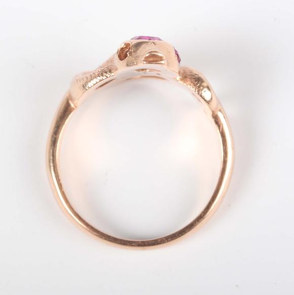 TooveysA gold, ruby and synthetic ruby ring, designed as a coiled snake, de
