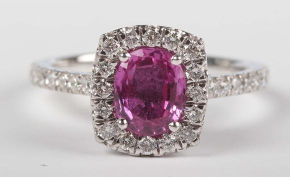 TooveysA platinum, pink sapphire and diamond cluster ring, claw set with th
