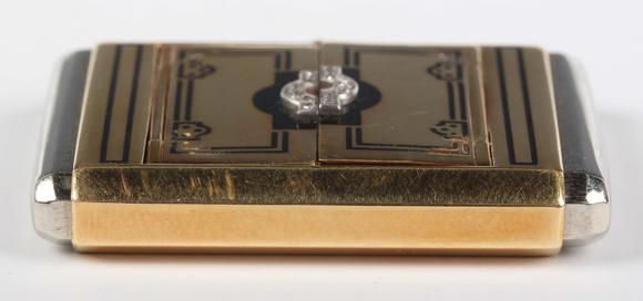 TooveysAn Art Deco Kreisler gold, black enamel and diamond set purse watch,