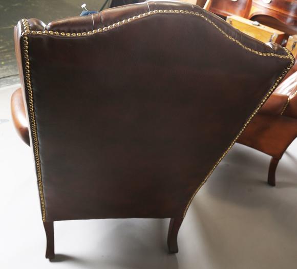 TooveysA pair of late 20th century George III style wing back armchairs, up