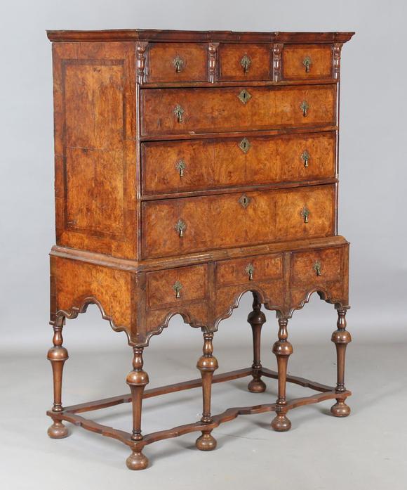 TooveysA George I and later burr walnut chest-on-stand with overall feather