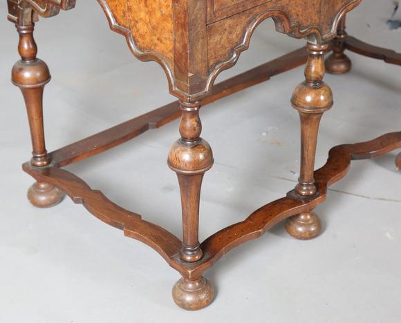 TooveysA George I and later burr walnut chest-on-stand with overall feather