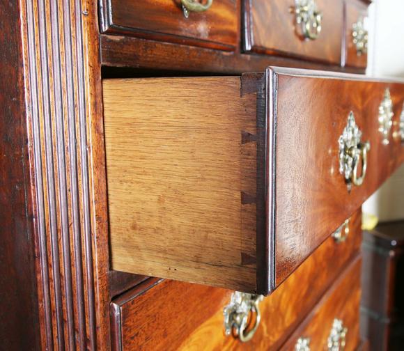 TooveysA George III mahogany secrétaire chest-on-chest, fitted with nine oa
