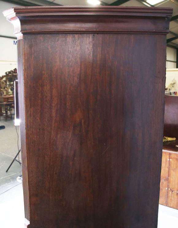 TooveysA George III mahogany secrétaire chest-on-chest, fitted with nine oa