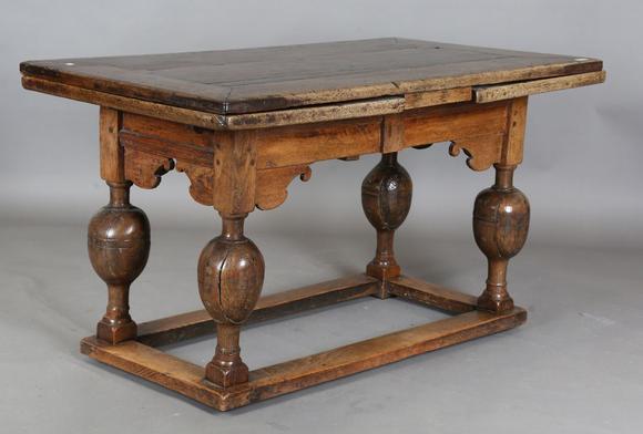 TooveysA 17th century oak draw-leaf refectory table, the rectangular top ra