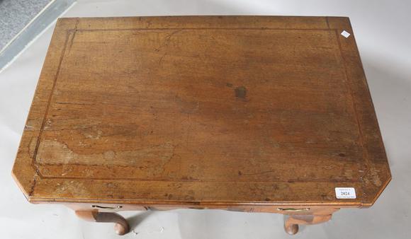 TooveysAn 18th century and later walnut lowboy, fitted with three oak-lined