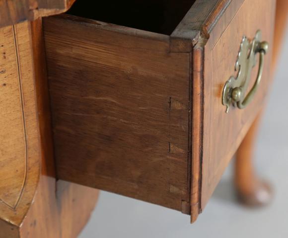 TooveysAn 18th century and later walnut lowboy, fitted with three oak-lined