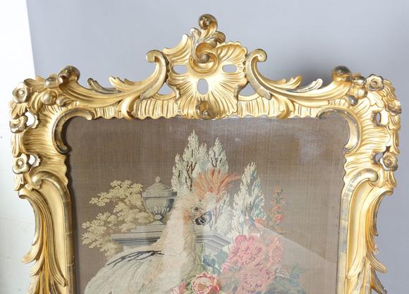 TooveysAn impressive mid-Victorian giltwood firescreen, the rococo style fr