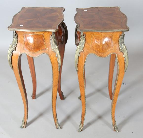 TooveysA pair of 20th century French mahogany bedside tables of shaped bomb