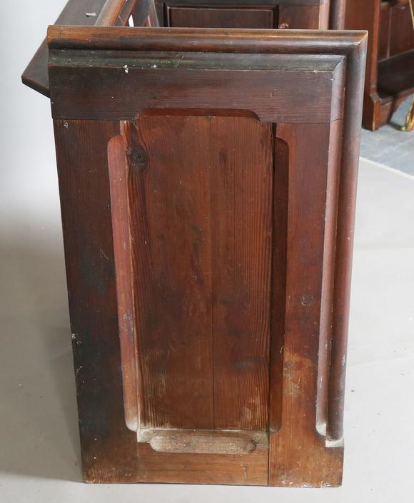 TooveysA late Victorian pitch pine cut-down pew with arched panel ends, hei