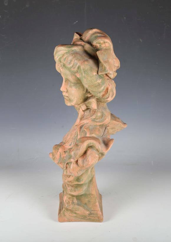 TooveysA modern cast composition head and shoulders portrait bust of a youn