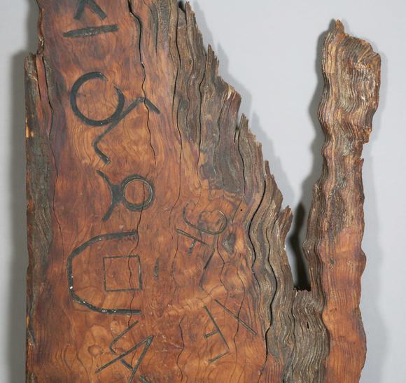 TooveysAn unusual wooden panel, covered in various incised letters and symb