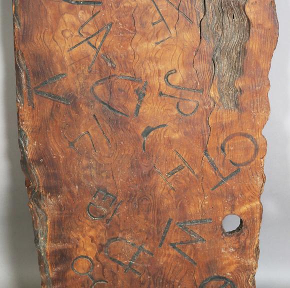 TooveysAn unusual wooden panel, covered in various incised letters and symb