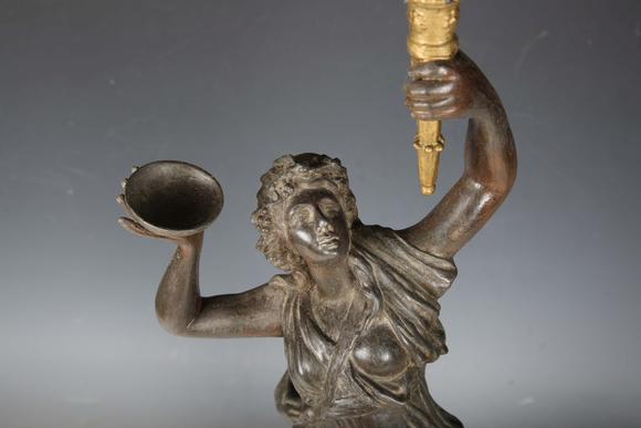 TooveysA late 19th century cast spelter figural table lamp in the form of a