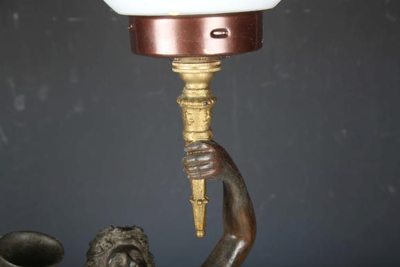 TooveysA late 19th century cast spelter figural table lamp in the form of a