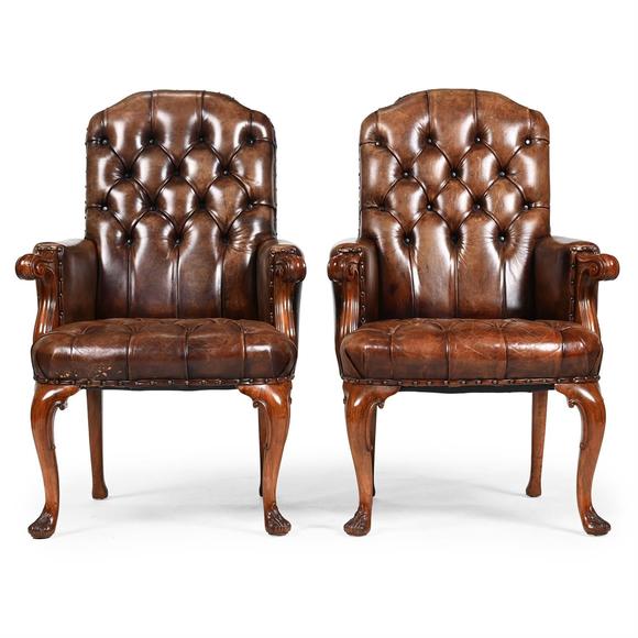 DreweattsA PAIR OF WALNUT AND BUTTONED LEATHER UPHOLSTERED LIBRARY ARMCHAIRS, FIRST HALF 20TH CENTURY