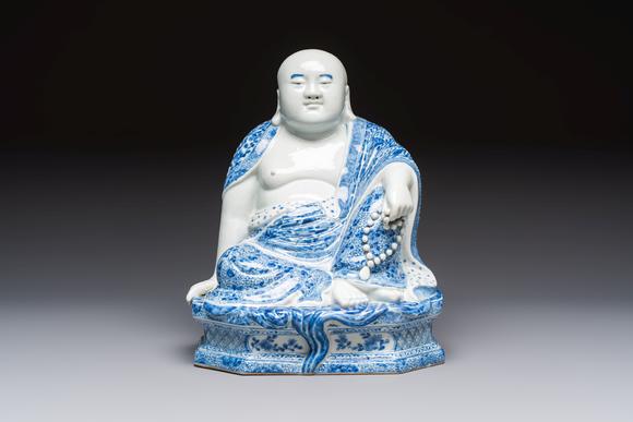 Rob Michiels AuctionsA fine Chinese blue and white Milefo Buddha on a wooden stand, Wei Hongtai Zao 魏洪泰造 mark, Republic